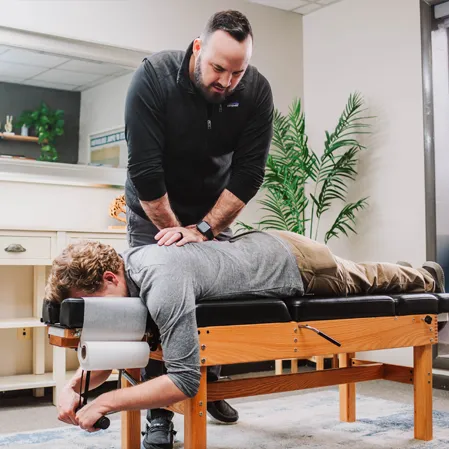 Chiropractor Boone NC Mark Torrie Adjusting Patient